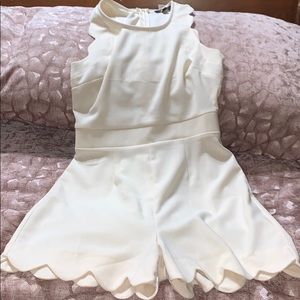 Ivory shorts romper with tags zipper in back